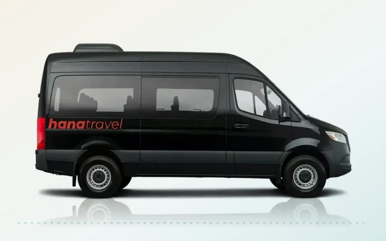 Black Mercedes-Benz Sprinter for airport transfers Studio photograph of a black Mercedes-Benz Sprinter vehicle shown from the side against a white background.